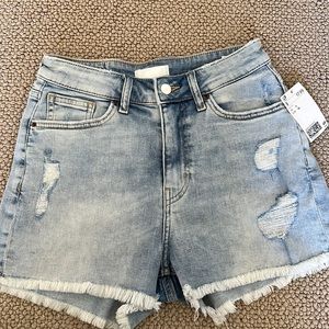 Never worn, denim shorts. They are high rise and stretchy.